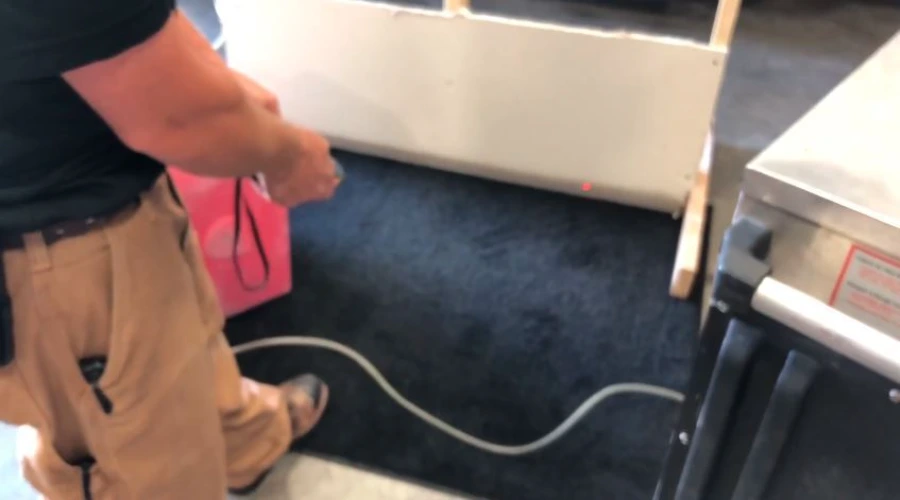 Garland Restore technician working on-site during a water damage restoration job