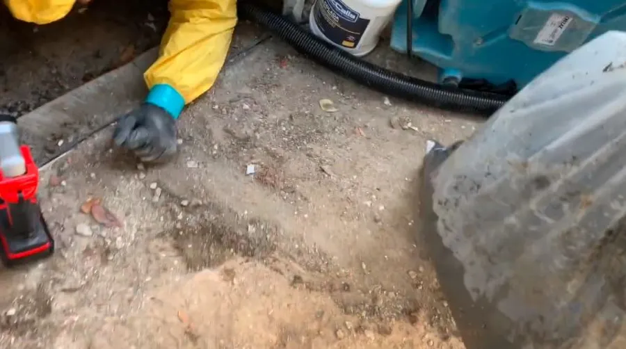 Garland Restore technician removing sewage contamination during a crawl space cleanup in Garland, TX