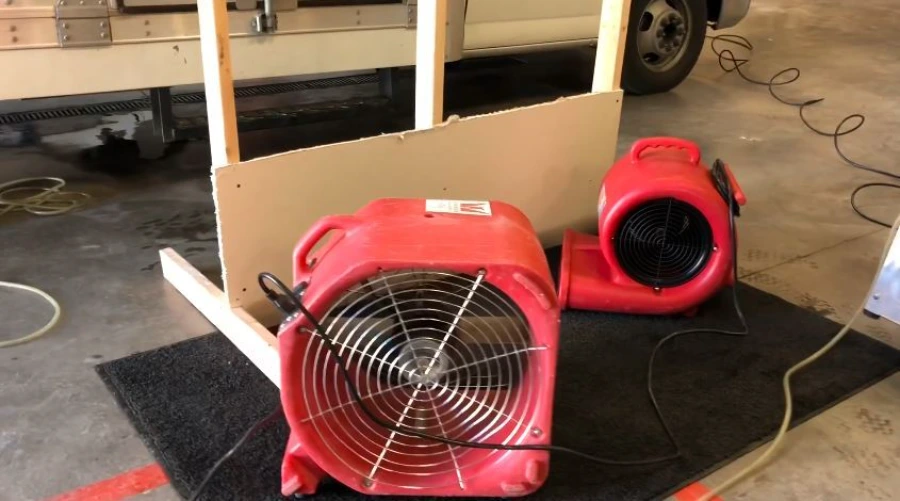 Industrial air movers and dehumidifiers used by Garland Restore for structural drying