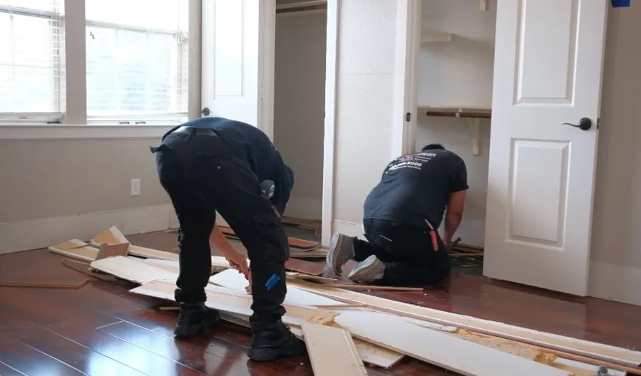 Garland Restore team providing a written water damage restoration cost estimate on-site in Garland, TX