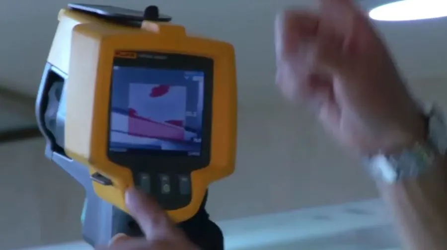 Garland Restore technician using thermal imaging to inspect water damage before extraction in Garland, TX