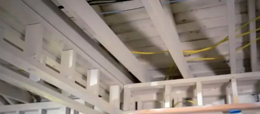 Exposed ceiling and roof framing during fire damage restoration assessment