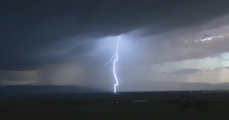 Storm damage Garland TX: lightning strike beneath a dark thunderstorm sky